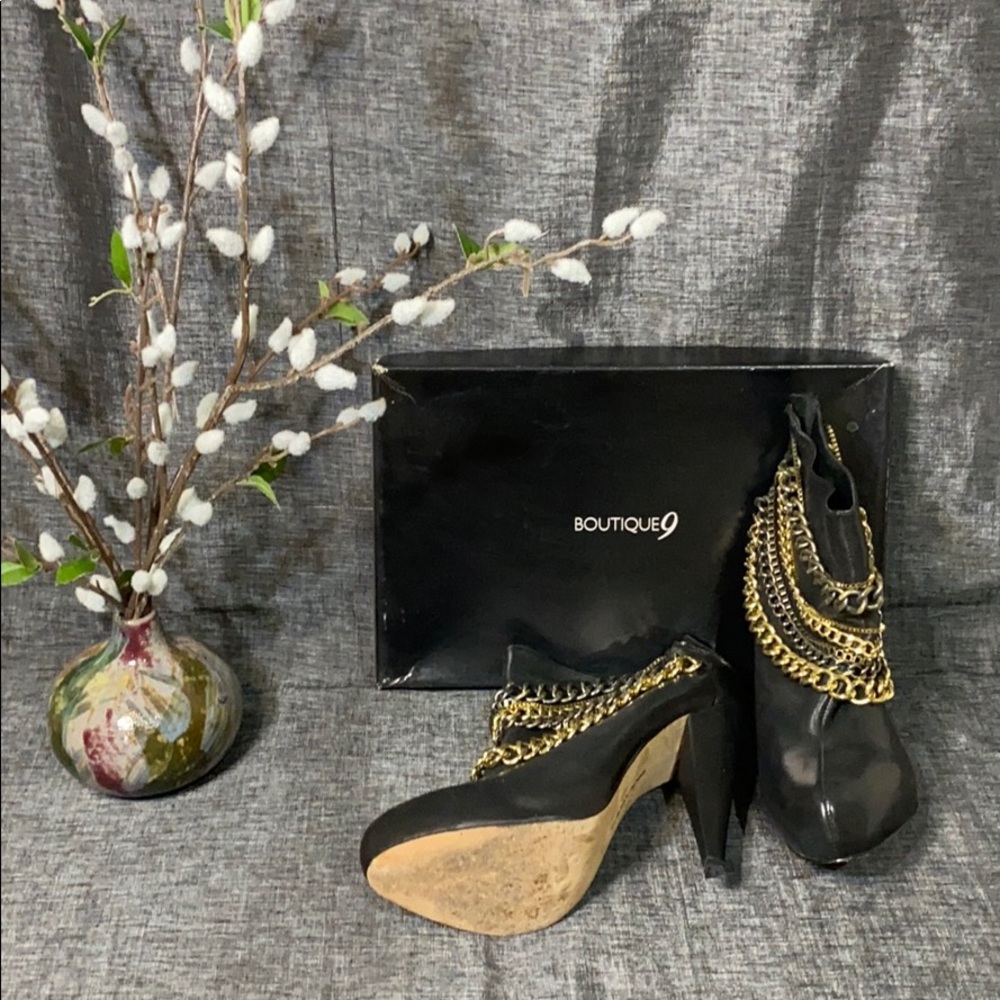 Black ankle boots with chain detail